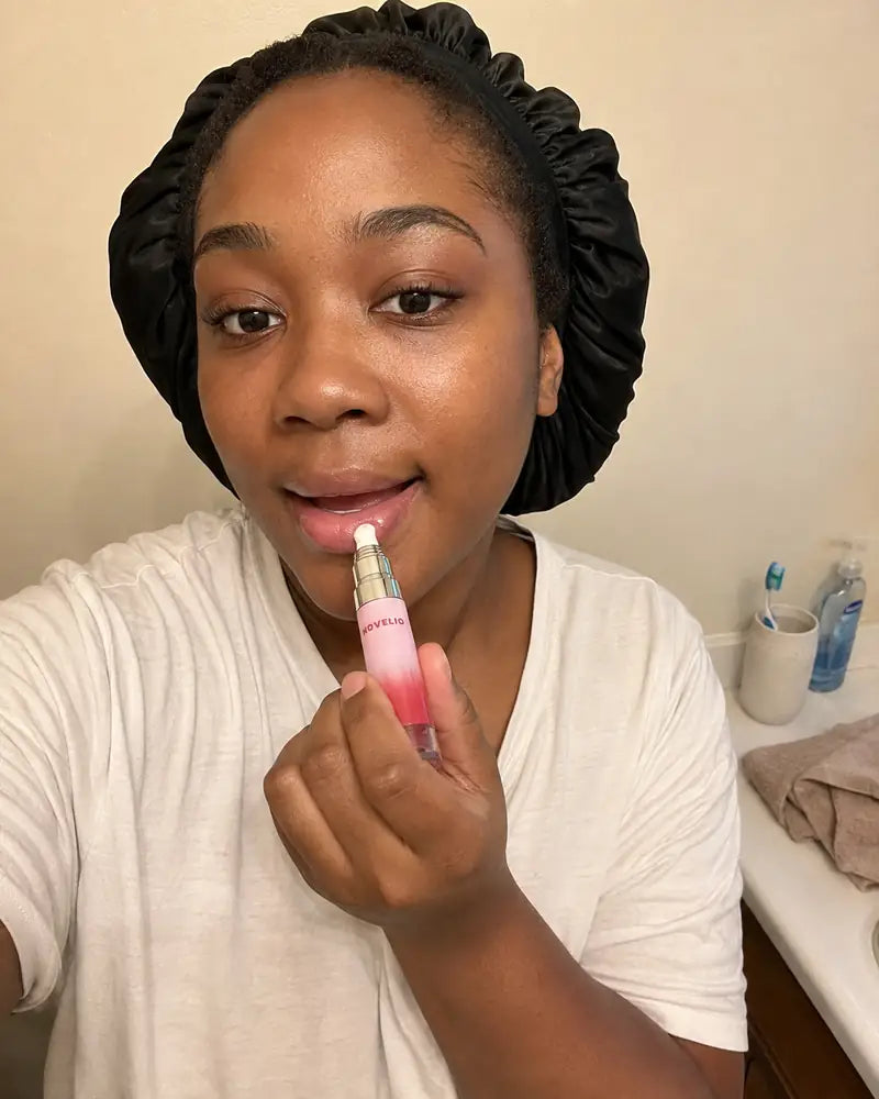 Jasmine from Atlanta applying Forever Pink Lip Essence in the morning