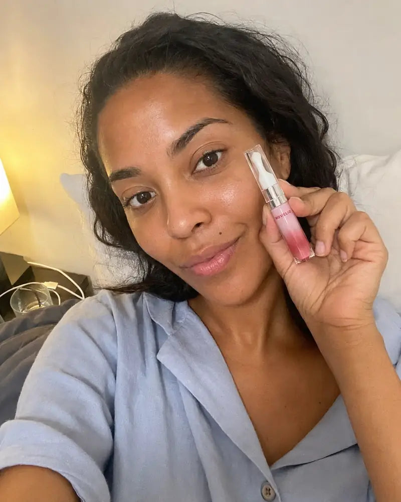 Yesenia from the Bronx with Forever Pink Lip Essence in bed